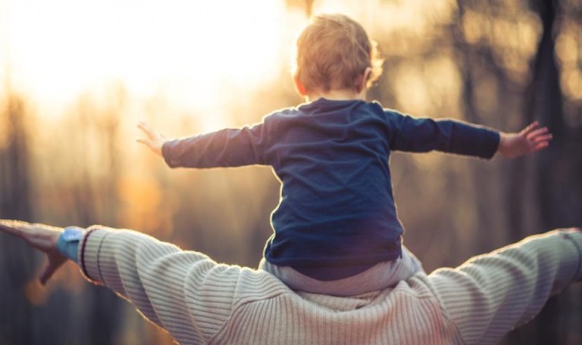 a baby on a person's back