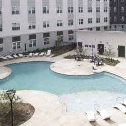 pool with modern stonework and reclining seats